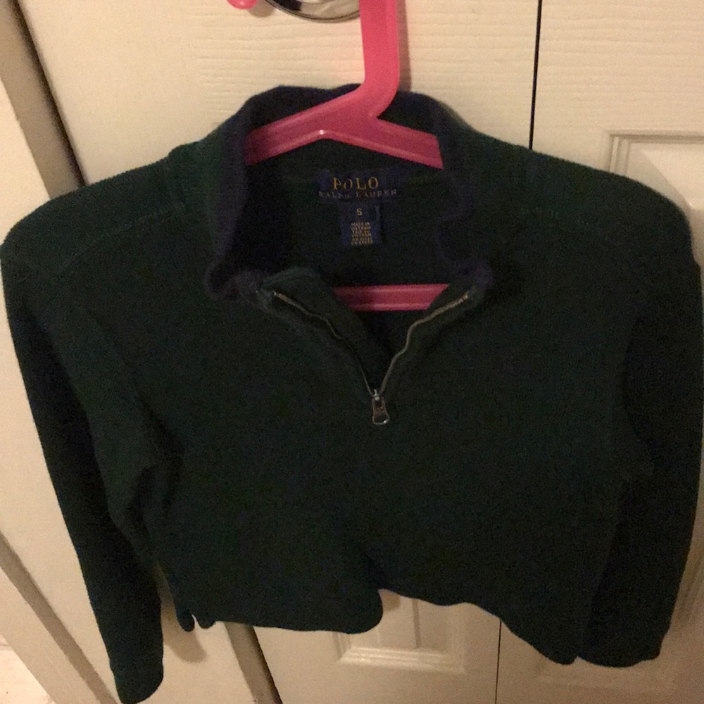 Polo long sleeve sweater with zip neck.